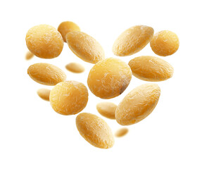 Yellow lentils in the shape of a heart on a white background