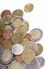 old coins of different countries on a white