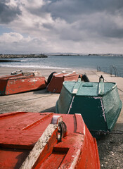 Fototapeta na wymiar Fishing boats at a pier on a stormy day