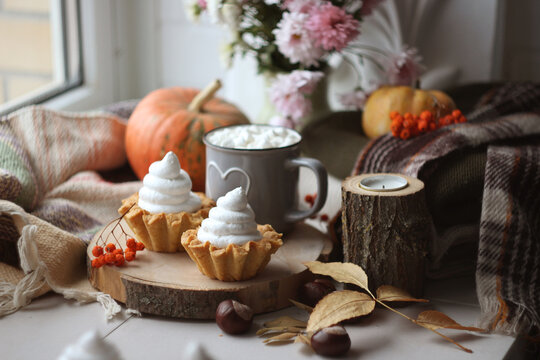 Cream baskets on a pumpkin background
