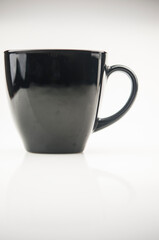 single black cup on white background. Copy space