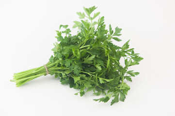 Fresh bunch green parsley bunch on white background. Top view, flat lay. Floral design element. Healthy eating and dieting concept