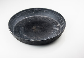 old cast iron frying pan on white background