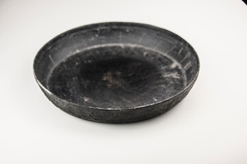 old cast iron frying pan on white background