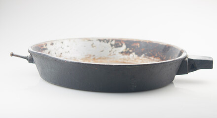old cast iron frying pan on white background