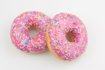 Two pink donuts on a white background