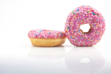 Two pink donuts on a white background