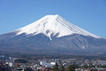 Mount Fuji and cityscape in morning of Fujiyoshida, Yamanashi Prefecture in Japan.
