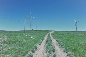 Zhambyl region, Kazakhstan - 05.15.2013 : Wind turbines located in an open hilly area to collect energy.