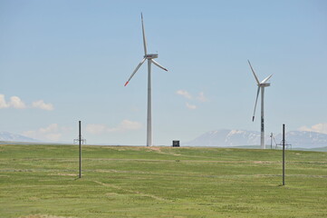 Zhambyl region, Kazakhstan - 05.15.2013 : Wind turbines located in an open hilly area to collect energy.
