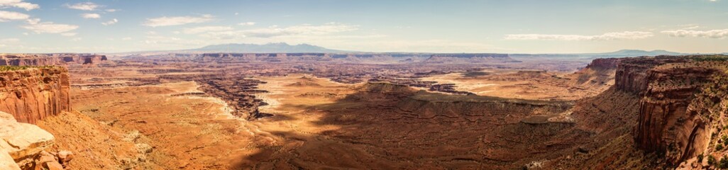 Panorama shot of sandy red canyons in island in the sky at sunny day of part canyonland national park in Utah, america