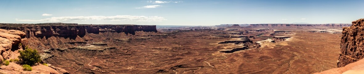 Panorama shot of sandy red canyons in island in the sky at sunny day of part canyonland national park in Utah, america