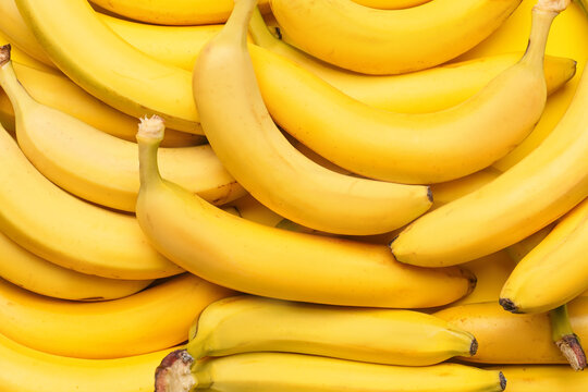 Tasty ripe bananas as background