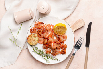 Fototapeta na wymiar Plate with tasty shrimps on color background