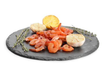 Slate plate with tasty shrimps on white background