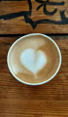 Americano with milk and heart-shaped foam
