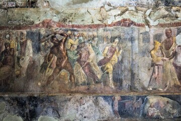 Fototapeta na wymiar Pompeii, Italy, June 26, 2020 detail of a fresco of a Roman house inside the Pompeii excavations brought back to life after excavations following the eruption of the Vesuvius volcano in 79 AD.