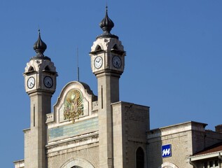 a structure with an ottoman signature on the dome and a clock in the minarets which is enchanting
