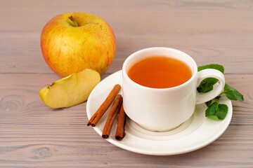 Apple tea drink served on wooden table