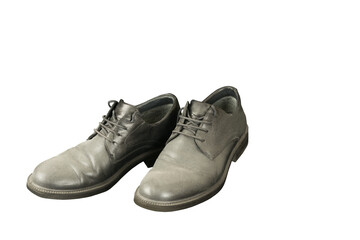Old black men dusty leather shoes isolated on white background, unemployment concept