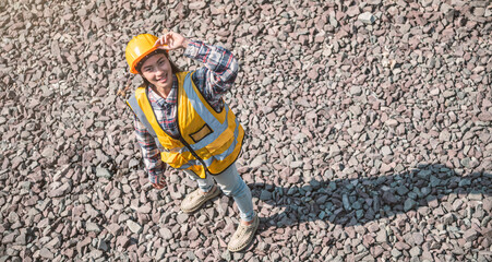 Top view of engineer asian woman are standing and smiling in work site