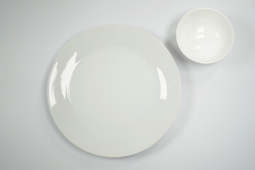 almost white Porcelain plate and bowl from top view