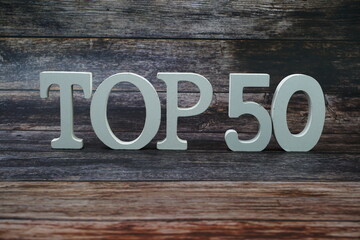 Top 50 word alphabet letters on wooden background