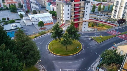 An aerial image of a traffic Island with circles around the outside