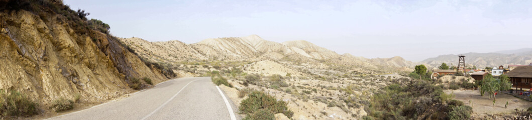 Fototapeta na wymiar panorama view of the Tabernas desert in Andalusia with a Spaghetti Western film set ghost town