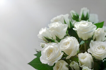 Obraz na płótnie Canvas White roses bouquet on white background with soft focus