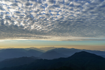 Cirrocumulus Cloud on a clear blue sky. Cirrus clouds in blue sky on sunny day. Altocumulus cloud on the blue sky. Fish scale cloud.