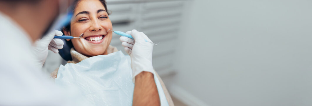 Happy woman getting dental checkup