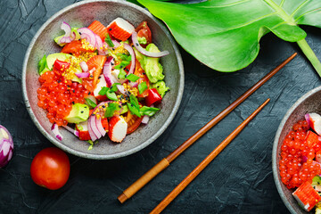Asian salad of fish caviar,crab meat and avocado
