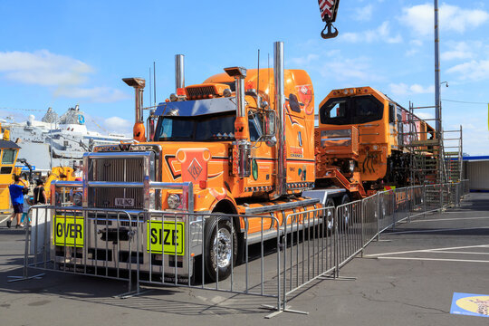 An oversize Western Star truck, towing a KiwiRail DL-Class diesel-electric locomotive on a trailer. Auckland, New Zealand, January 25 2020