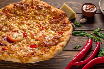 View of Italian pizza with spices and herbs