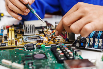 Fototapeta premium Technicial professinoal assemble part to repair computer motherboard and processor.