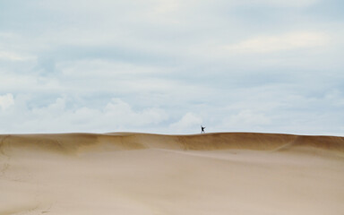 Sand dunes with person in distance