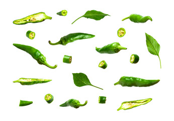 Green fresh pieces and whole chili pepper, leaves isolated on white background. Seasoning for dish, hot pepper, spicy spices for cooking, cayenne pepper, food. Set of peppers of different shapes