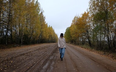 Fototapeta premium Woman on the forest road