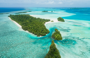 Fototapeta na wymiar Aerial view of tropical islands in Palau, beaches, lagoon, reefs and palm trees.