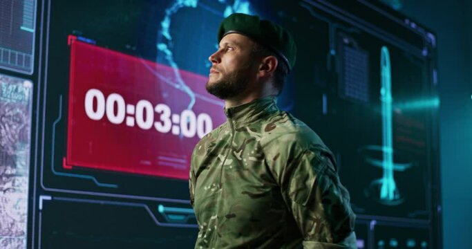 Male commander speaking with soldier in nuclear attack control center