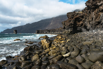 Fototapeta na wymiar Beautiful volcanic coastline landscape with Rocks and lava formations. La Maceta beach in La Frontera. El Hierro, Canary islands, Spain.