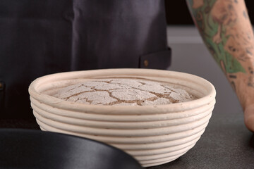 proofed rye sourdough in proofing basket