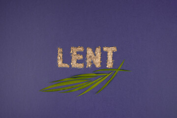 Text, word Lent made of ashes on purple background.  Lent Season, Holy Week, Palm Sunday and Good...
