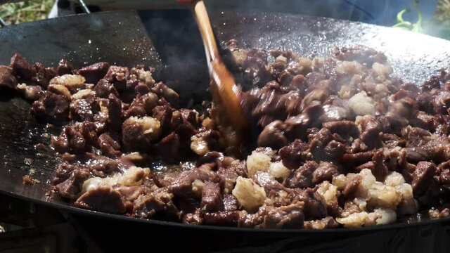 Roasting Meat on Outdoor on Tin Plate. Traditional Cooking Style of Fresh Meat. 