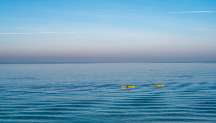 Two yellow boats over Mediterranean sea landscape. Tel Aviv, Israel.