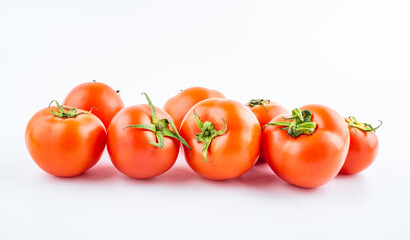 Fresh tomatoes on white background