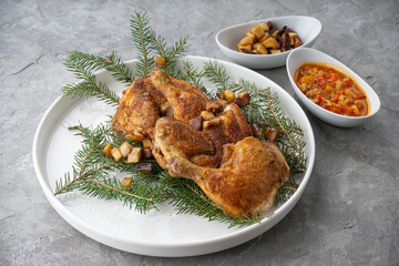 chicken thighs on a green tree in a white plate
