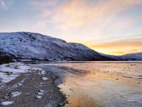 Mesmerizing sunset upon a fjord in Kvaloya Island, Norway