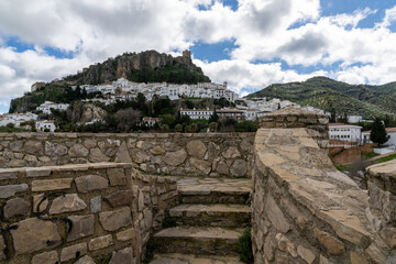 Fototapeta na wymiar view of the whitwashed Andalusian village of Zahara de la Sierra and its Moorish Castle on the hilltop